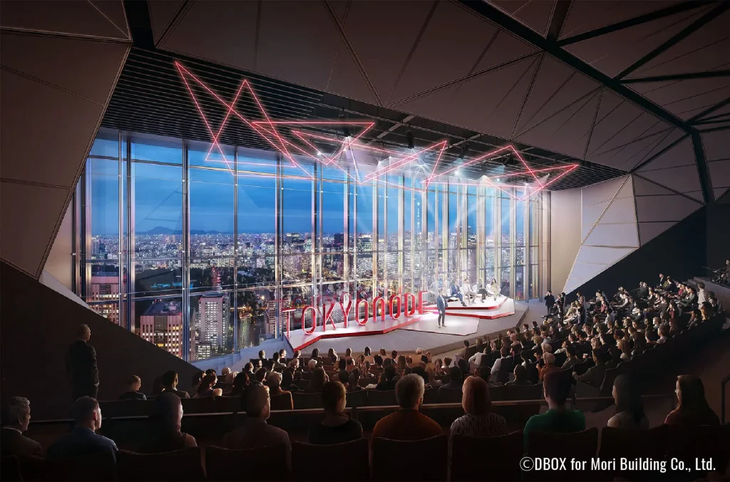 色とりどりの光で劇的にライトアップされた大谷資料館の巨大な地下採掘場を、来場者が探索している様子。没入型のイベント体験