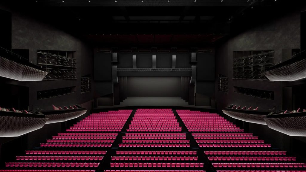 劇場の3Dイメージパース。座席はワインレッド色。2階・3階には、せり出しの観客席がある。
ステージ上部には、スピーカーが大量に並んで吊るされている。